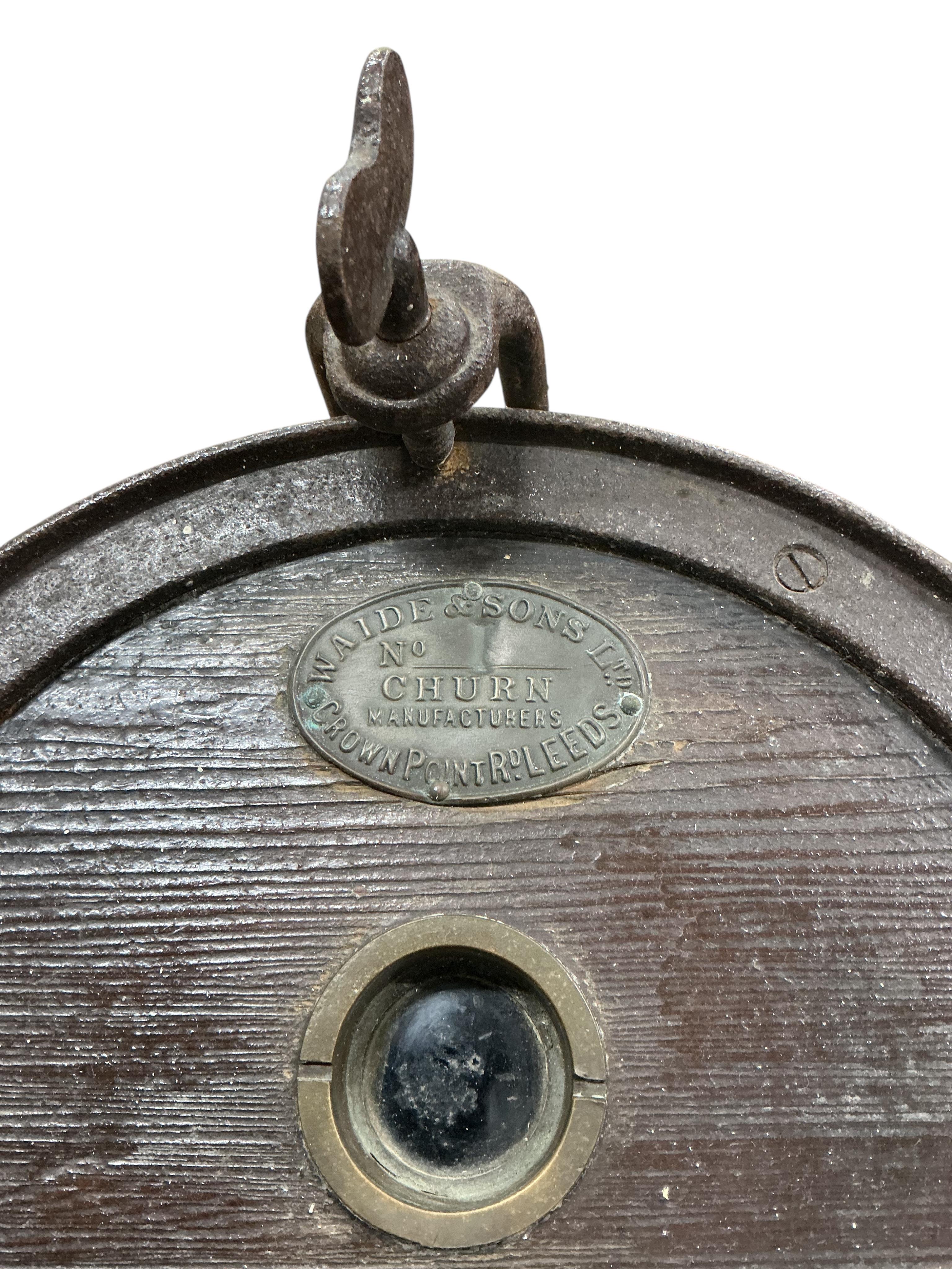 A Victorian Waide & Sons iron bound staved oak butter churn on stand